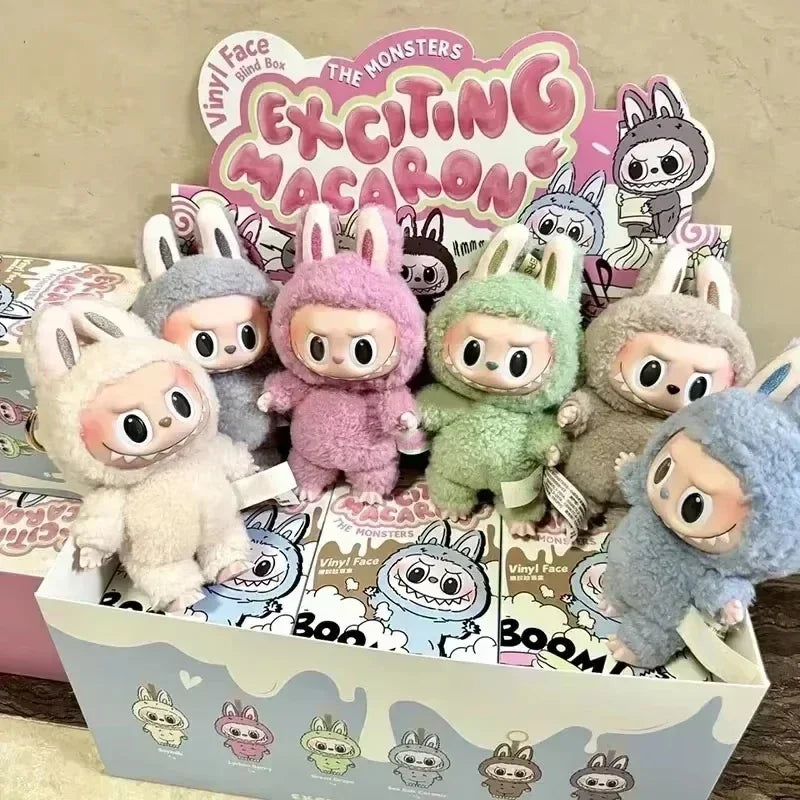 Collection of colorful plush toys with a 'Vinyl Face' box in the background