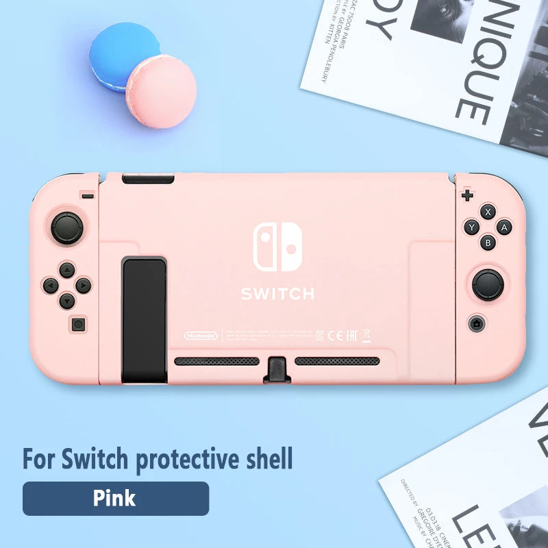 Pink Nintendo Switch console with protective shell on a light blue background