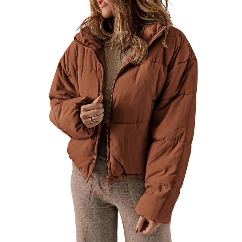 Brown puffer jacket worn by a person on a white background