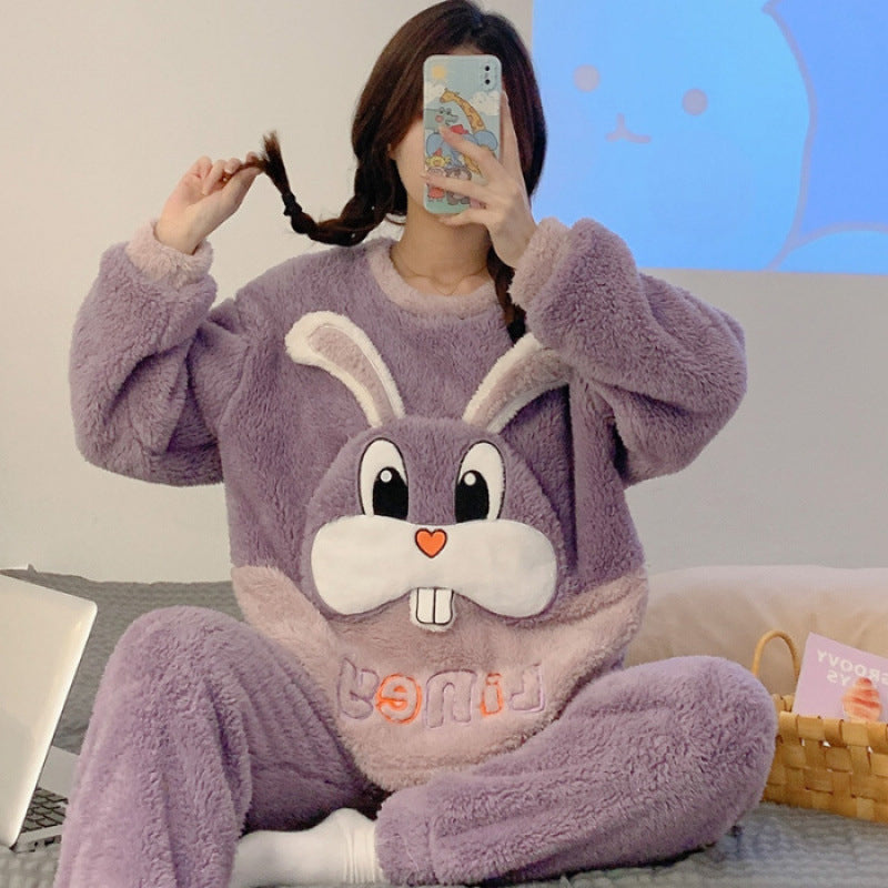 Person wearing a purple bunny-themed onesie taking a mirror selfie.