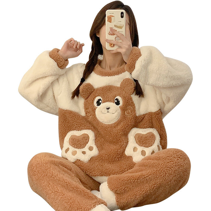 Person wearing a brown and beige bear-themed onesie taking a selfie.