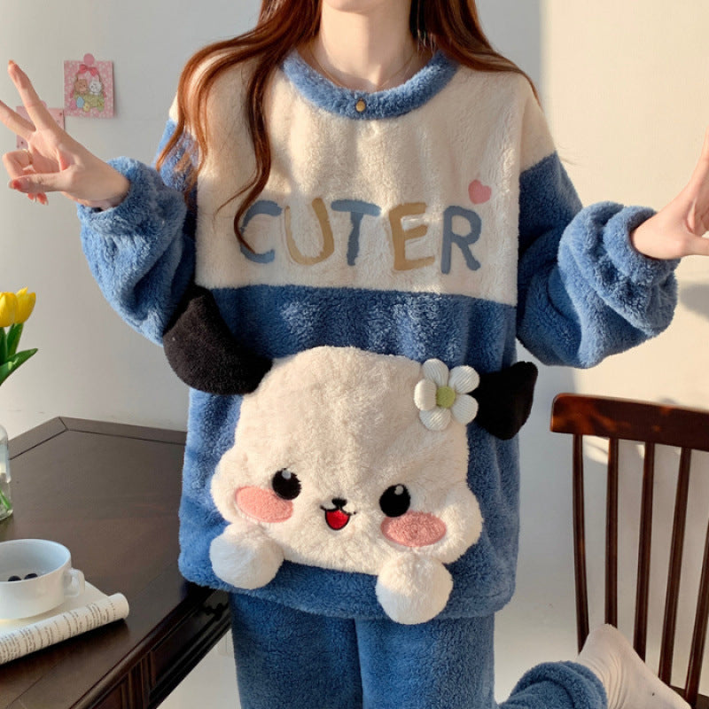 Person wearing a blue and white pajama set with a cartoon character design, making a peace sign.