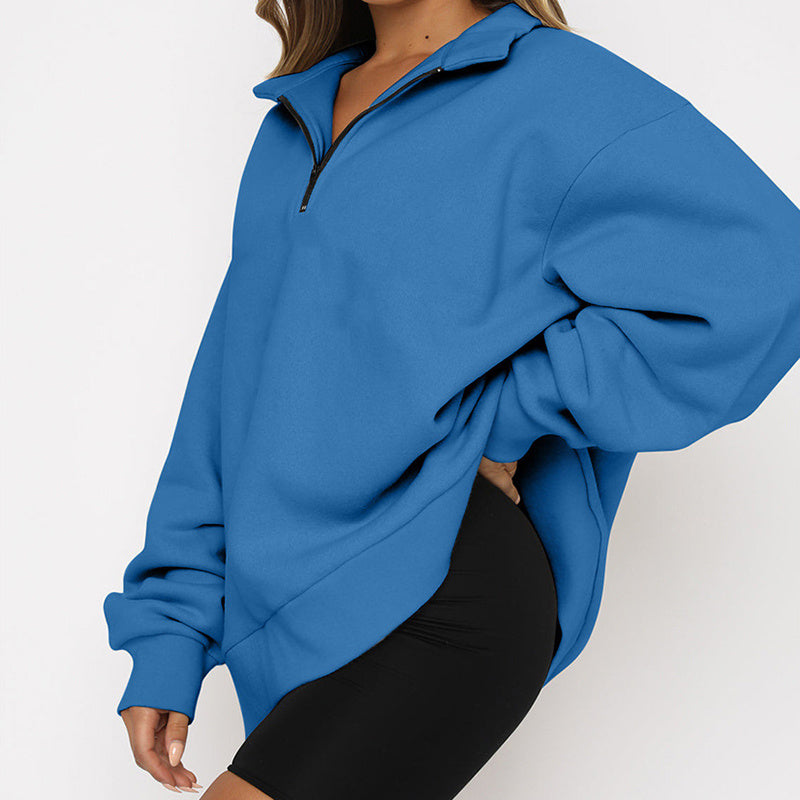Blue pullover worn by a person on a white background